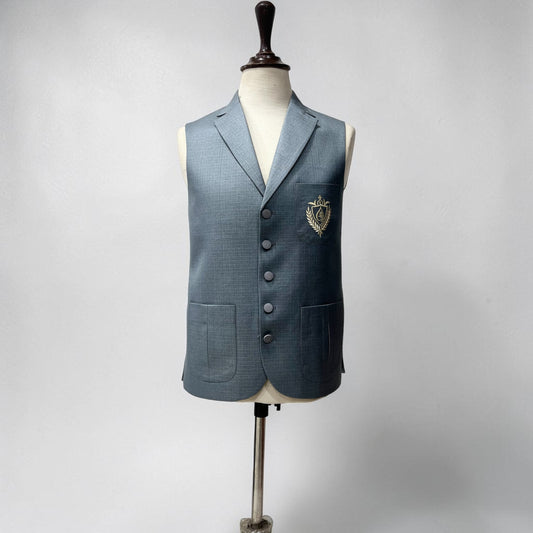 Blue textured vest on a mannequin against a gray background
